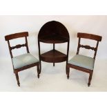 A George III mahogany corner washstand, of bowfront form, the second shelf with a single frieze