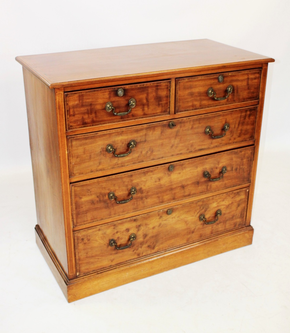 A 19th century mahogany chest of drawers, the rectangular moulded and cross banded top, above two