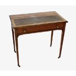 An Edwardian mahogany lady's writing table, the rear hinged panel enclosing a stationery compartment