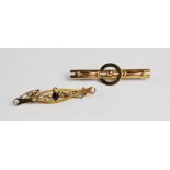 A Victorian 9ct gold bar brooch, designed as two plain polished bars with circular motif to centre