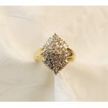 A diamond 14ct gold cluster ring, the tiered marquise shaped cluster comprising forty-one round
