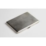 An Art Deco silver cigarette case, of rectangular form with engine turned decoration to exterior,