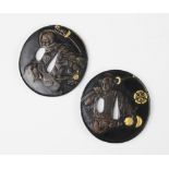 Two Chinese/Japanese bronze parcel gilt samurai Tsuba, each of circular form and relief moulded with