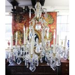 A French style glass mounted gilt metal six branch chandelier, mid 20th century, of cage form, the
