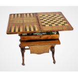 A Victorian burr walnut games compendium and sewing table, the rectangular hinged top enclosing