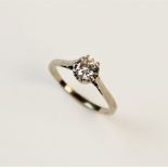 A diamond solitaire ring, the central round brilliant cut diamond weighing approx. 0.62 carats,