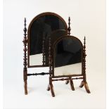 A graduated pair of 19th century Puginesque dressing table mirrors, the turned walnut supports