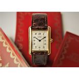 A lady's Must de Cartier silver gilt Tank Vermeil wristwatch, the rectangular cream dial with Arabic