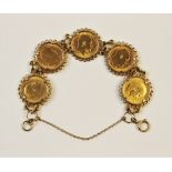 A 9ct gold bracelet set with five Edwardian half-sovereigns, one dated 1907, one dated 1908, three