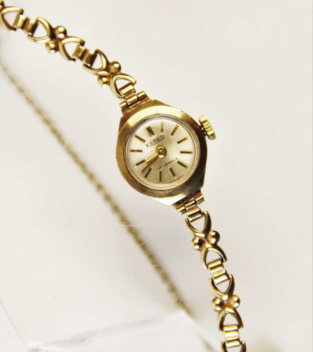 A lady's 9ct vintage 'Kered' wristwatch, the circular silver dial with baton markers, set to a plain