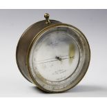 A brass cased altimeter by Negretti & Zambra of London, the altimeter with silvered dial
