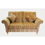 Two matching Parker Knoll sofas, late 20th century, comprising a two seater and a three seater,