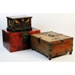 A carved Indian hardwood box, applied with iron banding, hinges and swing handle, incised with