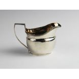 A George III silver cream jug by Duncan Urquhart & Naphtali Hart, London 1806, of plain polished