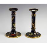 A pair of Worcester Aesthetic candlesticks, circa 1879, each decorated with butterflies and flora,
