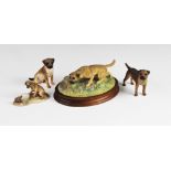 A Border Fine Art group, 'Border terrier with Hedgehog', model no. 066, by D Geenty, on a wooden