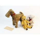 A vintage plush fox terrier soft toy by 'Chiltern Hygenic Toys', applied with glass eyes, 36cm high,
