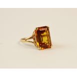 A 9ct gold citrine set dress ring, comprising an emerald cut citrine measuring 17mm x 13mm, claw set