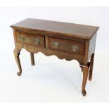 A George III style oak and mahogany cross banded dresser base, of cottage proportions, the