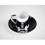 After Damien Hirst (b.1965), a 'For The Love Of God...' electro-plated porcelain anamorphic cup