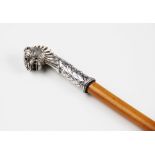 A Indian silver mounted Malacca swagger stick, 19th century, the tapered cane mounted with a lions
