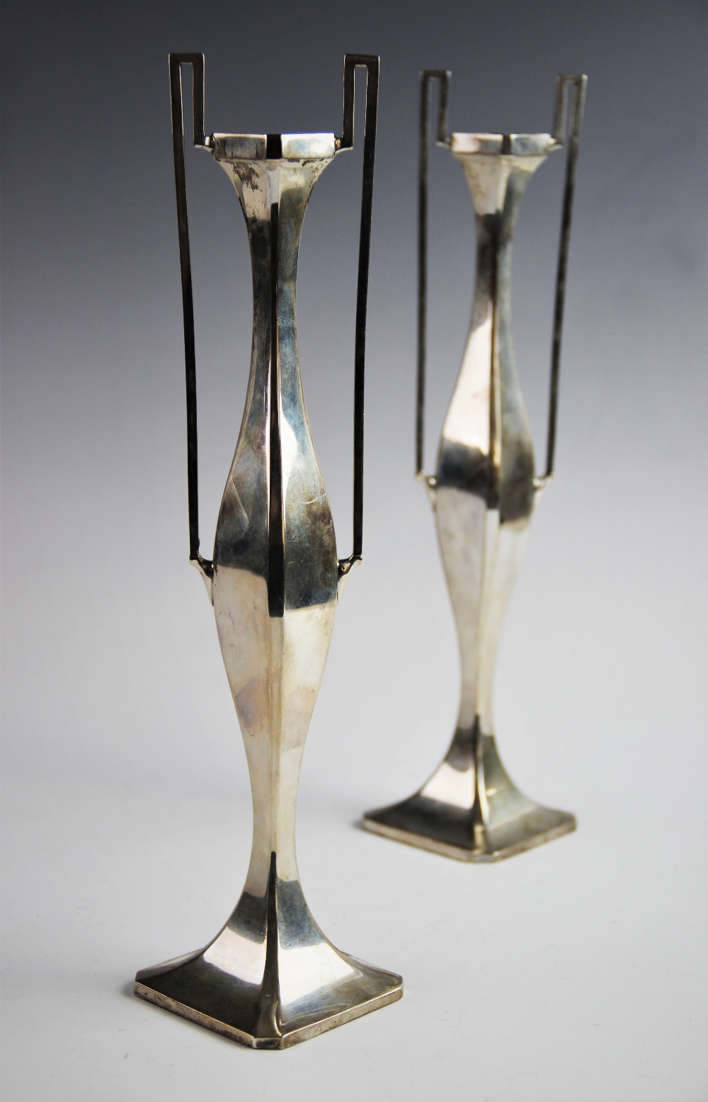 A pair of Art Nouveau silver stem vases by James Deakin & Sons, Chester 1908, of plain polished