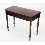 A George III mahogany tea table, the 'D' shaped hinged top raised upon a tapering ring turned