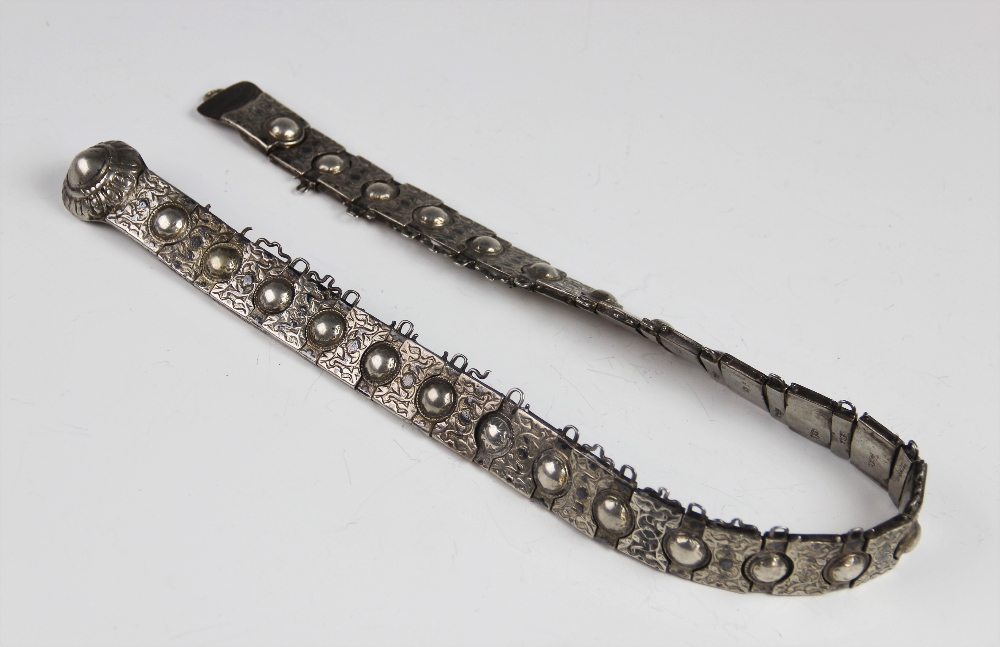 A late 19th century Russian silver belt, each link with embossed floral decoration with a circular
