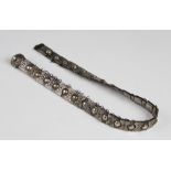 A late 19th century Russian silver belt, each link with embossed floral decoration with a circular