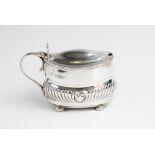A Victorian silver wet mustard by William Hutton & Sons, London 1887, of oval form with half