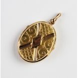 A Victorian yellow metal locket pendant, of oval form, each side with applied rope twist scrolling