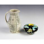 A Moorcroft Black Ryden vase of squat baluster form, decorated in the Papaver pattern, designed by