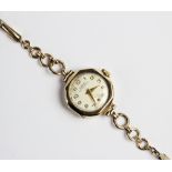 A vintage 9ct gold Liga lady's wristwatch, the circular white dial with Arabic numerals and