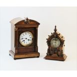An early 20th century walnut cased mantel clock, with a Japy Freres movement, the architectural case