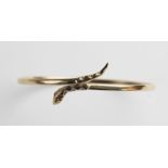 A 9ct gold snake bangle, the plain polished oval bangle with stylised snake head and tail, with