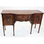 A George III style mahogany sideboard, circa 1900, the central convex drawer above a fluted apron,