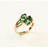 A paste set 9ct gold four-leaf clover ring, the central cluster comprising four heart-shaped green