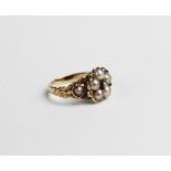 A 19th century diamond and pearl floral cluster ring, the central cluster comprising five half-