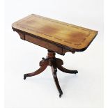 A George IV mahogany and rosewood cross banded folding tea table, the rectangular top with rounded