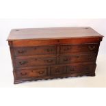 A George III oak and mahogany cross banded Lancashire mule chest, the rectangular hinged top above
