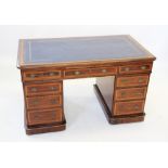 An Edwardian mahogany and satinwood crossbanded twin pedestal desk, the rectangular moulded top with