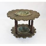 A 17th century style brass and walnut Spanish brazier table, the shaped brass coated table top