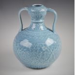 A Chinese porcelain clair de lune gourd vase, Qianlong seal mark, the vase of double gourd form with