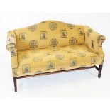 A pair of George III style camel back sofas, covered in sandy coloured patterned fabric, the