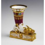 A continental gilt porcelain cornucopia with bull's mask decoration, 19th century, the rim with
