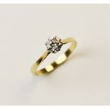 A diamond solitaire ring, comprising a central round brilliant cut diamond weighing approximately