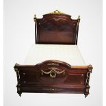 A Louis XVI style walnut and gilt metal embellished bedroom suite, 20th century, comprising; a