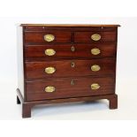 An early George III walnut chest of drawers, the rectangular moulded top above a brushing slide