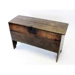 A 17th oak six plank coffer, the plain plank sides and top raised upon 'V' cut end supports, 61cm