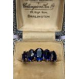 A five stone ring, the five, oval graduated sapphires (with total weight of approx 5.00ct) each